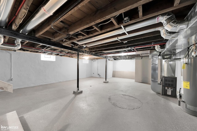 basement featuring heating unit and gas water heater