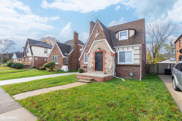 view of front of home with a front lawn