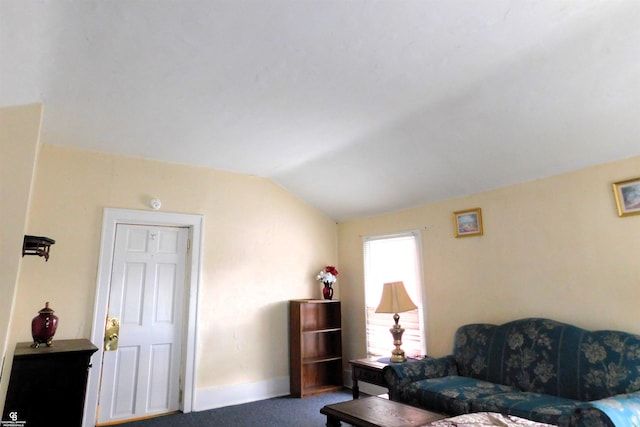 carpeted living room with lofted ceiling