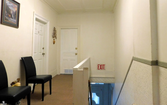 interior space featuring carpet and ornamental molding