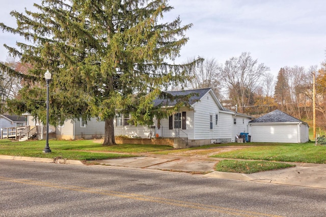 view of side of property with a garage, an outdoor structure, and a yard