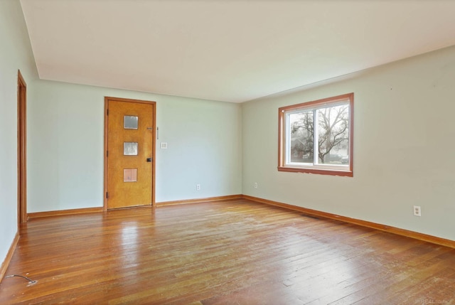 spare room with light wood-type flooring