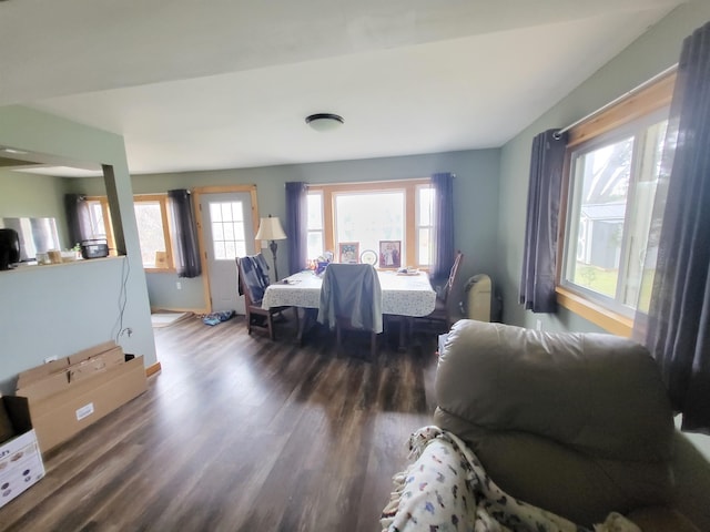 dining space with dark hardwood / wood-style floors