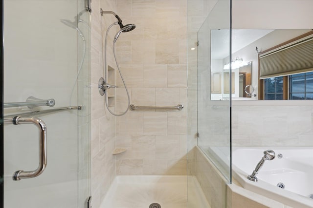 bathroom featuring shower with separate bathtub