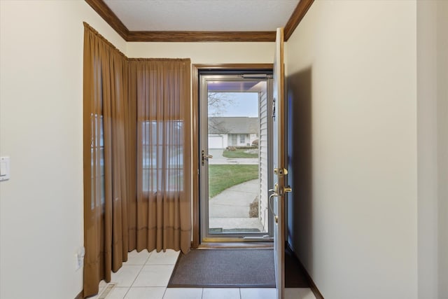 doorway with light tile patterned floors, a textured ceiling, and ornamental molding