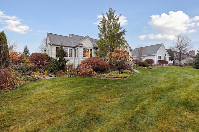 view of home's exterior with a lawn