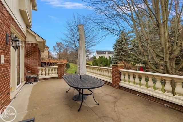 view of patio / terrace with a balcony