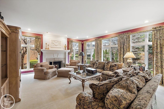 carpeted living room with recessed lighting, crown molding, and a lit fireplace