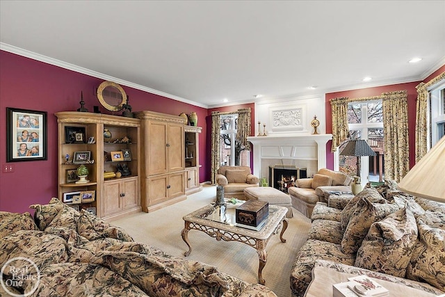 living room with recessed lighting, a lit fireplace, ornamental molding, and light colored carpet