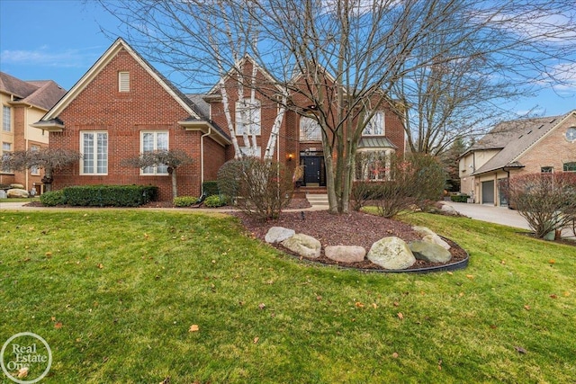 tudor house featuring brick siding and a front lawn