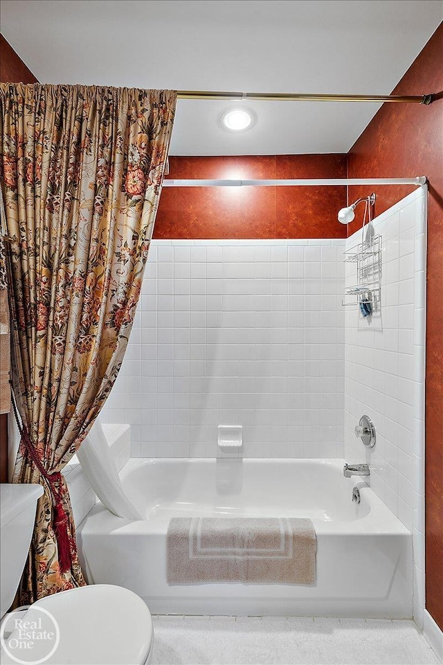 full bath featuring shower / bath combo and toilet