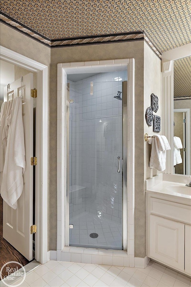 bathroom featuring a shower stall and vanity