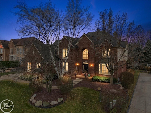 view of front of home featuring brick siding