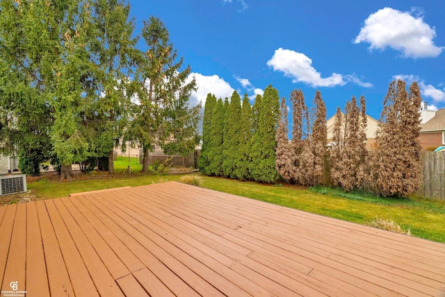 wooden terrace with a lawn