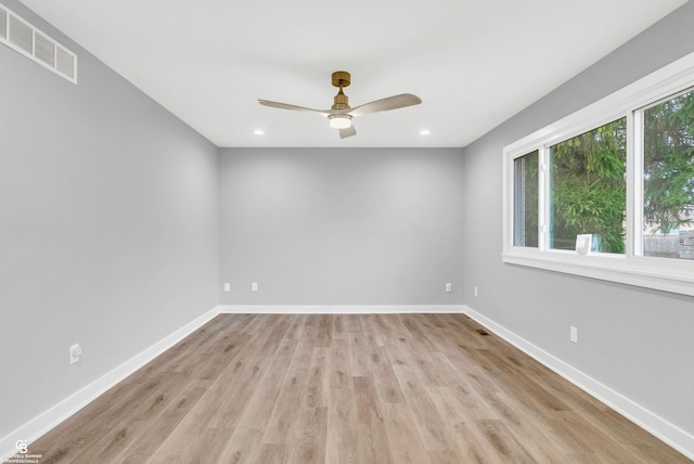 empty room with light hardwood / wood-style flooring and ceiling fan