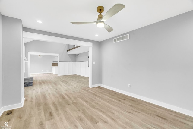 unfurnished living room featuring ceiling fan and light hardwood / wood-style floors