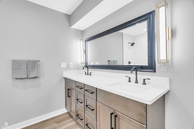 bathroom with hardwood / wood-style floors and vanity