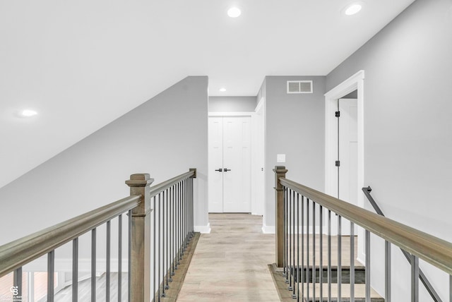 corridor featuring light hardwood / wood-style floors