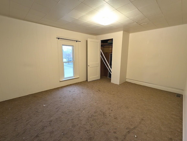 unfurnished room featuring carpet flooring