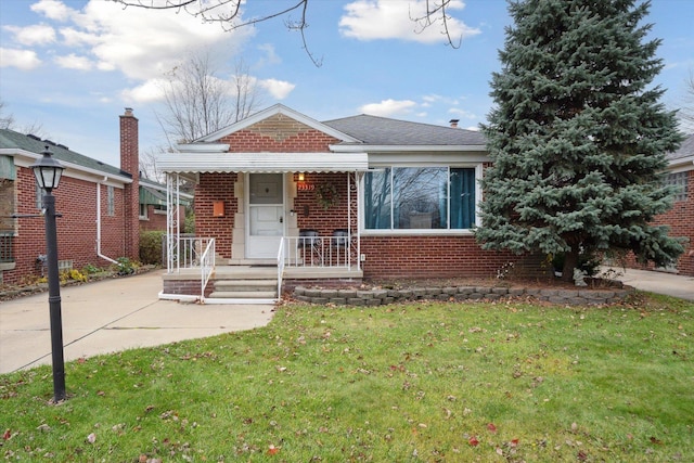 bungalow with a front lawn