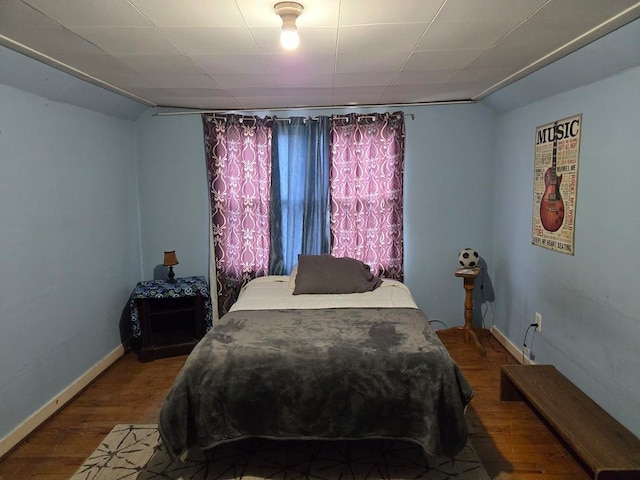 bedroom with hardwood / wood-style flooring