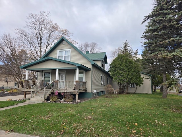 view of front of home with a porch and a front yard