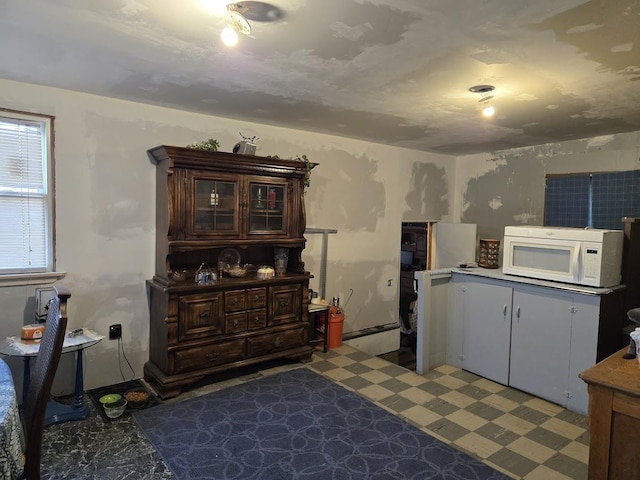 kitchen featuring dark brown cabinetry