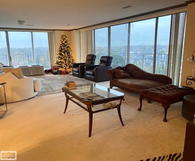 living room featuring light carpet and expansive windows