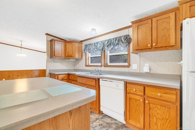 kitchen with a textured ceiling, sink, decorative light fixtures, and white appliances