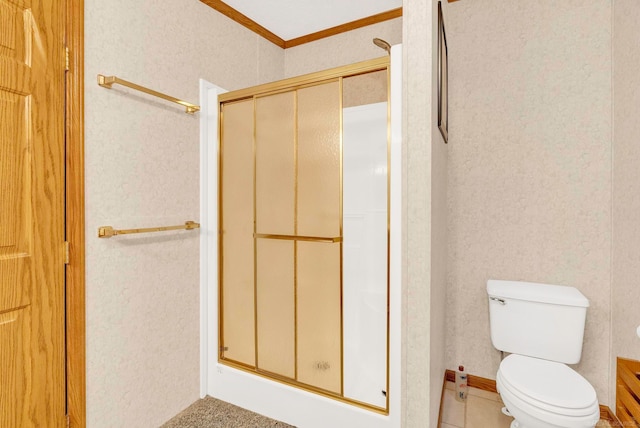 bathroom with toilet, an enclosed shower, and crown molding