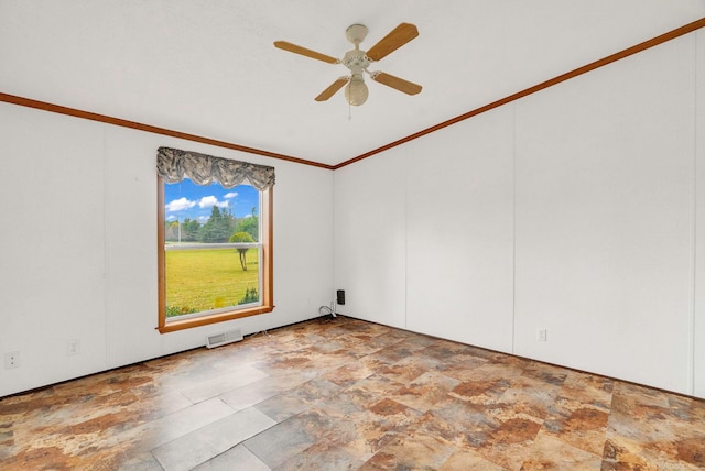 spare room featuring ceiling fan and ornamental molding