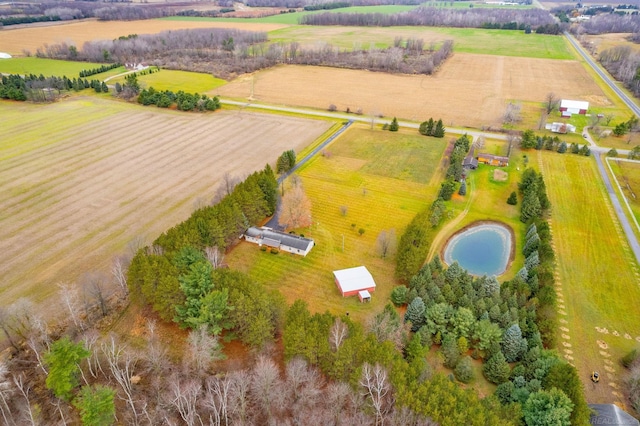 drone / aerial view featuring a rural view and a water view