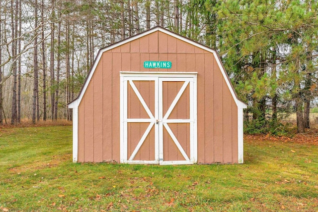 view of outdoor structure with a lawn