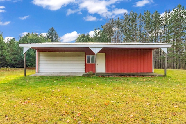 garage with a yard