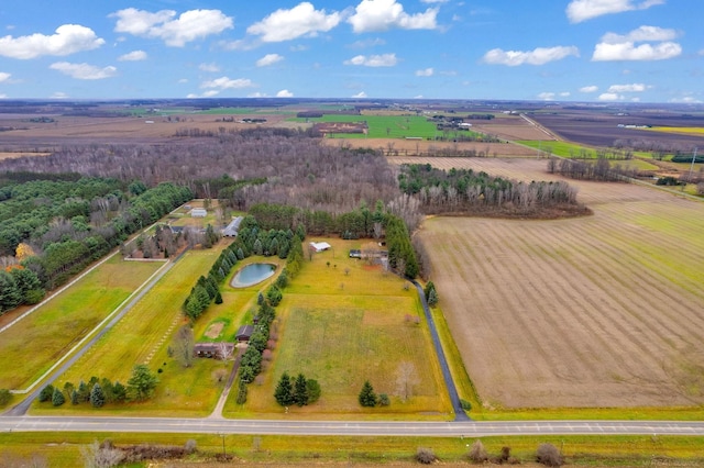 birds eye view of property featuring a rural view