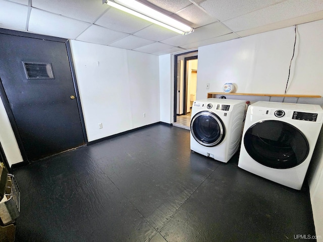 clothes washing area with washing machine and clothes dryer