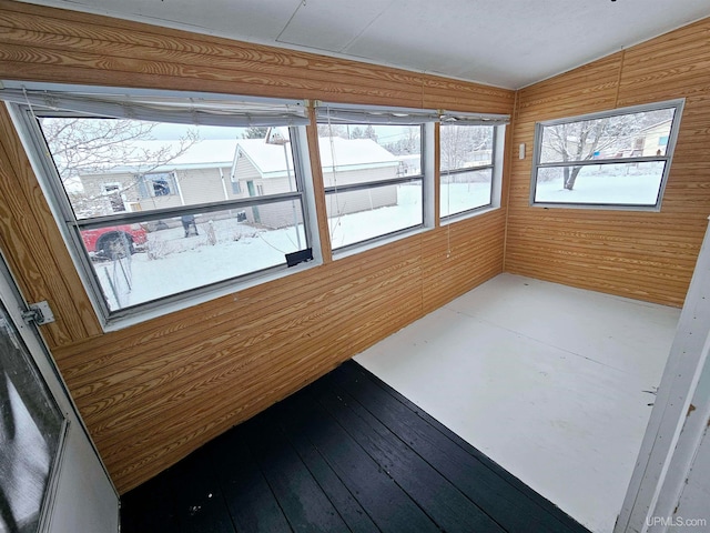 unfurnished sunroom with vaulted ceiling