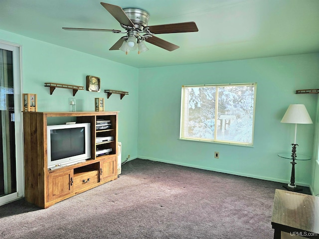 carpeted living room with ceiling fan