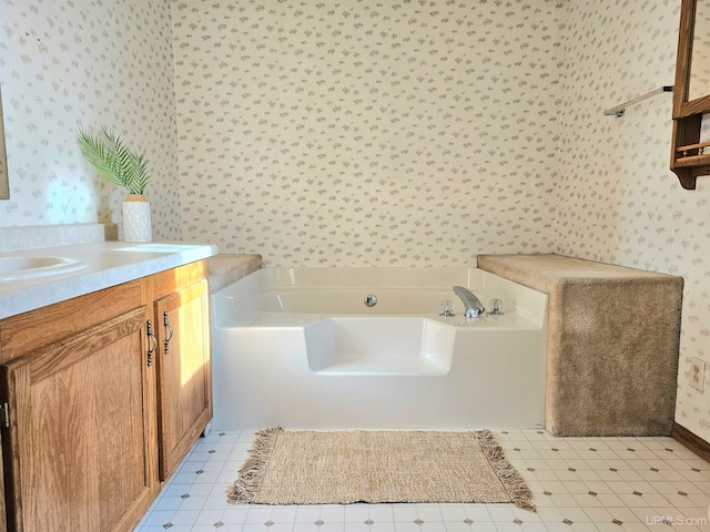 bathroom featuring a bath and vanity