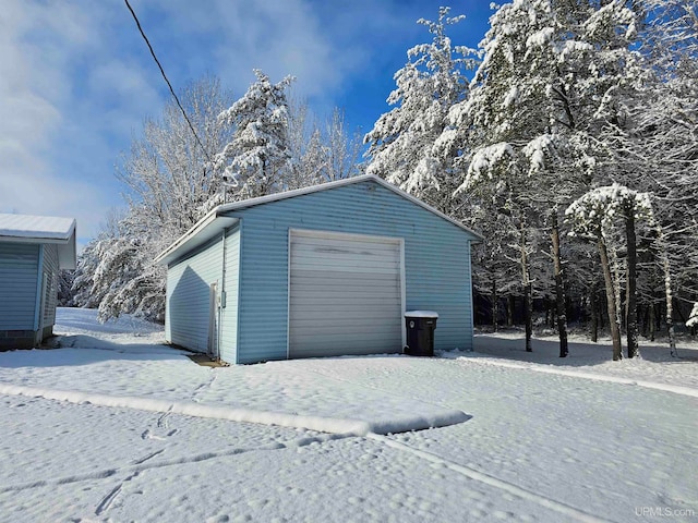 view of snow covered garage