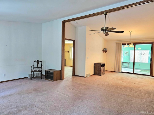 carpeted spare room featuring ceiling fan