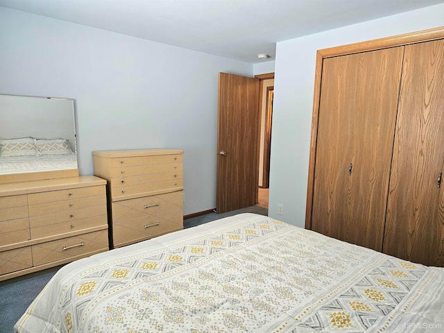 carpeted bedroom with a closet