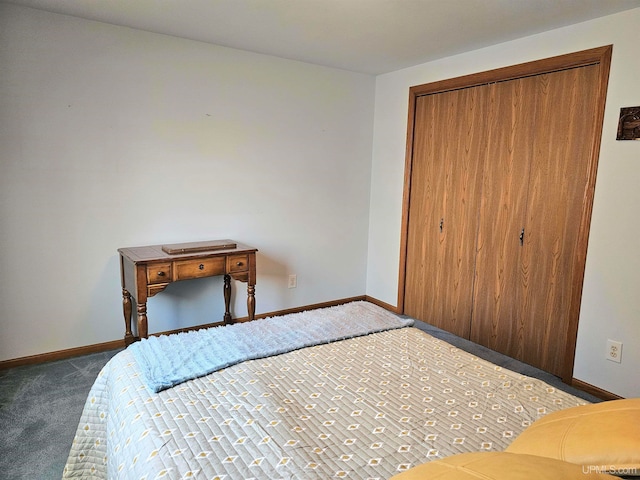 unfurnished bedroom with a closet and dark carpet