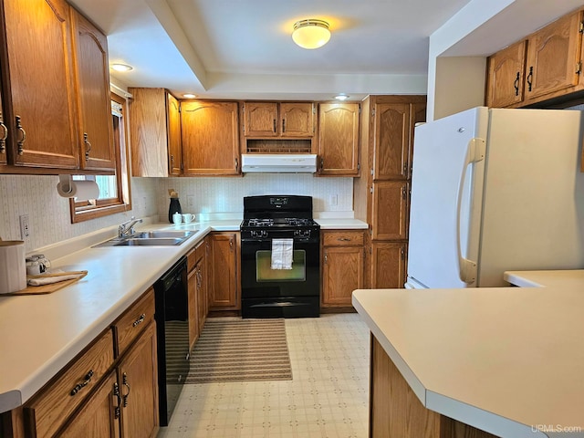 kitchen featuring sink, extractor fan, and black appliances