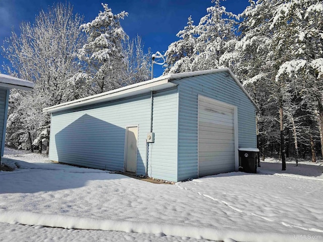 view of snow covered garage