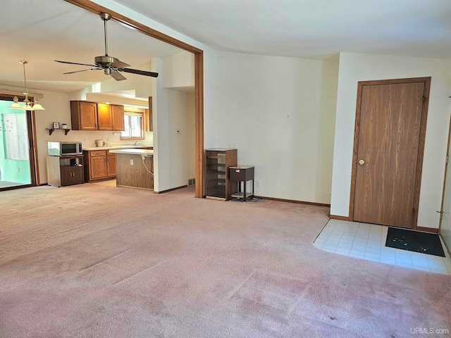 living room with ceiling fan, light colored carpet, and lofted ceiling