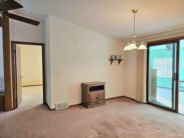 unfurnished room with ceiling fan and carpet floors