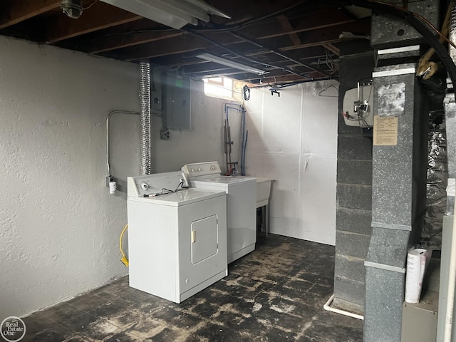 washroom featuring washing machine and clothes dryer and electric panel