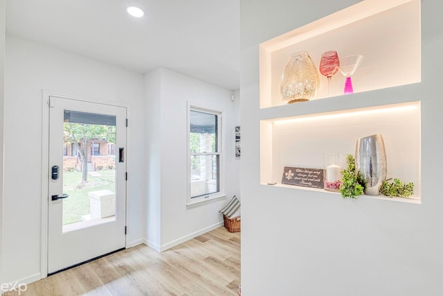 entryway with light hardwood / wood-style floors