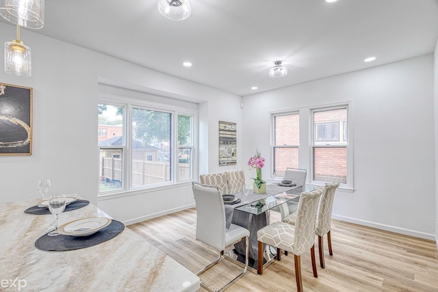 dining area with light hardwood / wood-style floors